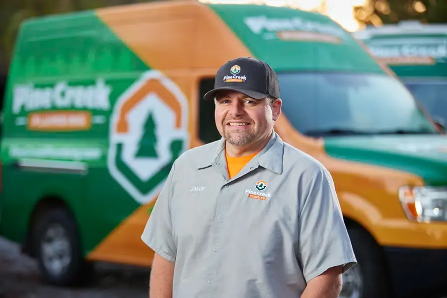 Pine Creek Plumbing owner smiling with truck in Wexford, PA