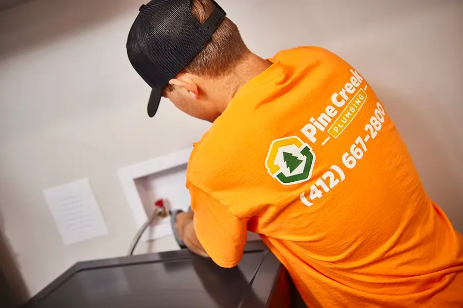 Pine Creek Plumber working inside Wexford, PA home
