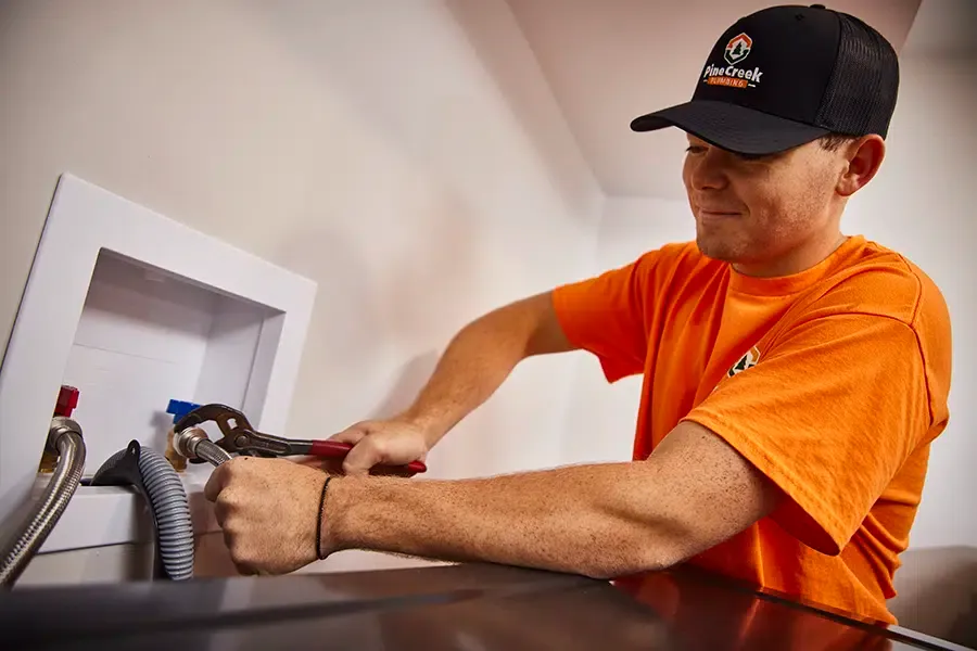 Pine Creek Plumber working inside Wexford, PA home