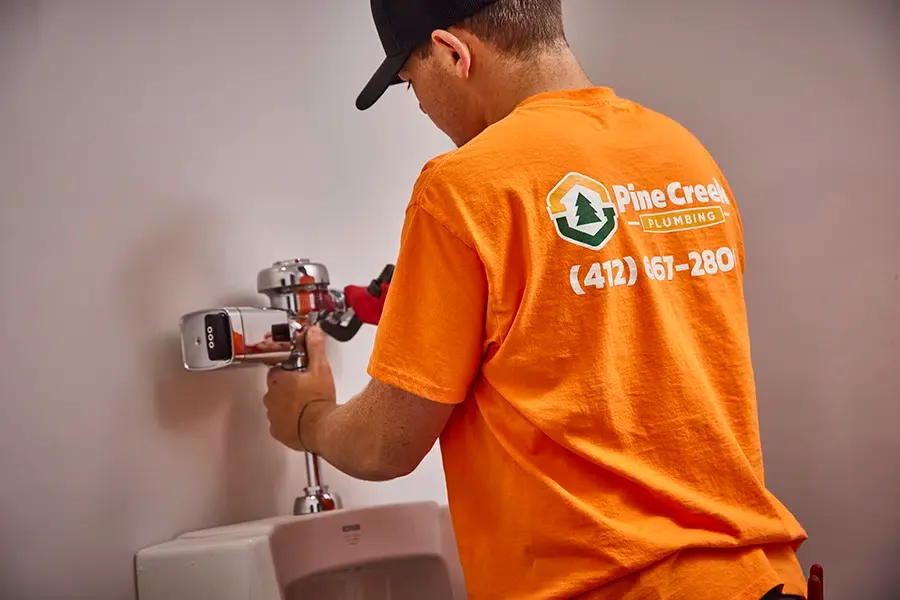 Pine Creek Plumber working inside Wexford, PA home